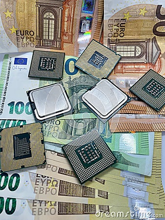 Closeup of golden plated CPUs on Euro banknotes.200 EURO 100 EURO 50 EURO Stock Photo