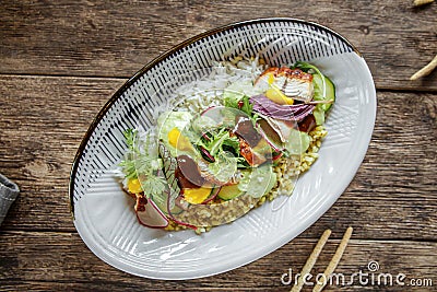 Closeup on gourmet bowl of unagi eel and couscous Stock Photo