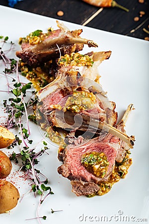Closeup on gourmet fried lamb chops with sauce Stock Photo