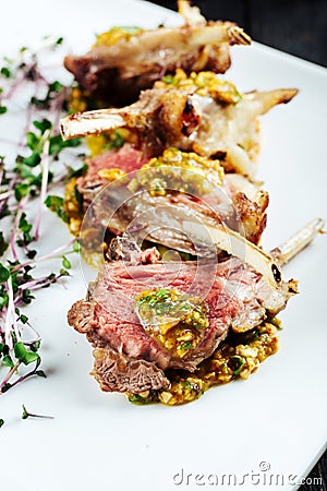 Closeup on gourmet fried lamb chops with sauce Stock Photo