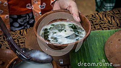 Closeup Grass Jelly green cincau on traditional pottery served in traditional market Stock Photo