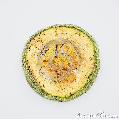 Closeup grilled zucchini medallion on white background. Stock Photo