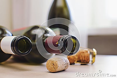 Closeup of a group of champagne corks on the table with Empty wine bottle Stock Photo