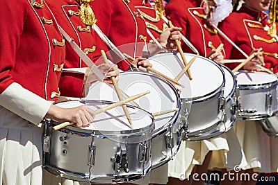 Closeup of group of girls of fans in red military uniform with d Stock Photo