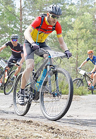 Closeup of group of mountain bike cyclists in the forest Editorial Stock Photo