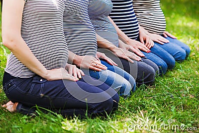 Closeup of group pregnant bellies. Pregnant women Stock Photo