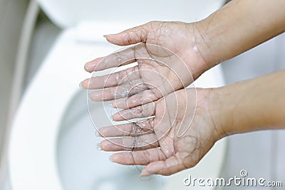 Closeup Hair loss on woman hand in the bathroom Stock Photo