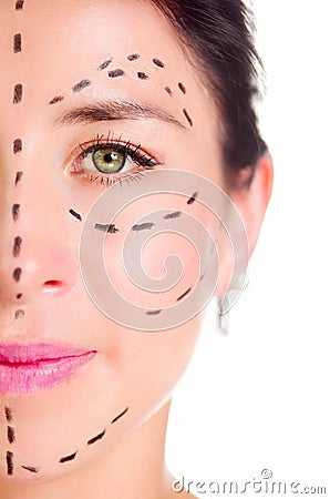 Closeup half of face caucasian woman with dotted lines drawn around left eye, preparing cosmetic surgery Stock Photo