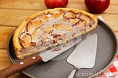 Closeup half of homemade pie with apple, cinnamon and yogurt topping Stock Photo