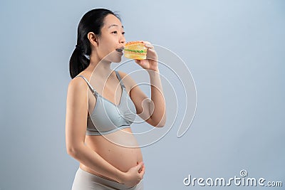 Hamberger junk food and pregnant woman is not good healthy for mother and infant Stock Photo