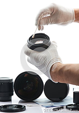 Closeup of hand cleaning lens Stock Photo