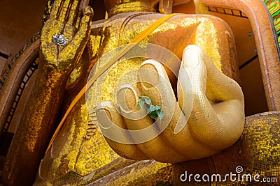 Closeup at hand of Gold big buddha statue temple wat tham sua Stock Photo