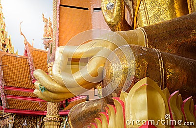 Closeup at hand of Gold big buddha statue temple wat tham sua Stock Photo