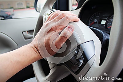 Closeup of hand honking car horn Stock Photo