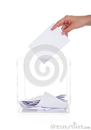 Closeup Of Hand Inserting Ballot In Box Stock Photo