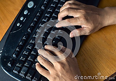 closeup of hand man typing on keyboard Stock Photo
