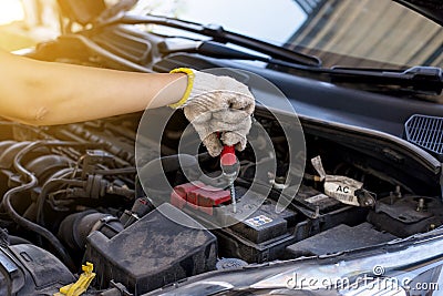 Hand mechanic engineer fixing car battery at garage,concept car maintenance Stock Photo