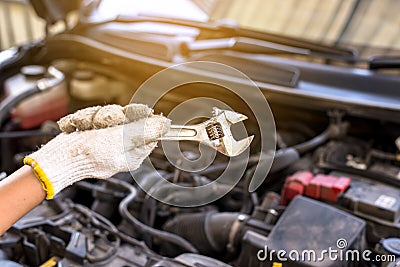 Hand mechanic engineer fixing car at garage,concept car maintenance Stock Photo