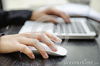 Closeup of hand on mouse Stock Photo