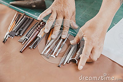 closeup hand tool for leather tailor maker. old handcraft master piece working equipments Stock Photo