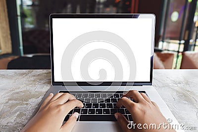 Closeup hand typing keyboard computer in coffee shop Stock Photo