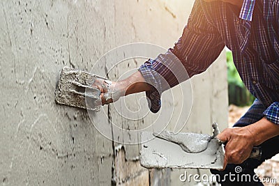 closeup hand of worker are plastering Stock Photo