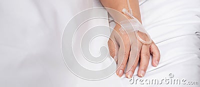 Closeup hands asian elderly woman asleep with surveillance in hospital ward, patient senior unconscious lying. Stock Photo