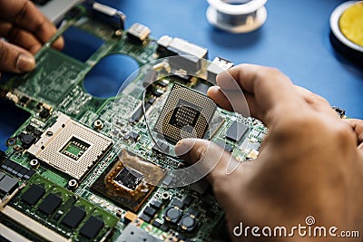 Closeup of hands with computer mainboard microprocessor electronics parts Stock Photo