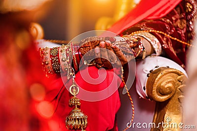 Closeup of hands with henna tattoos during an Indian traditional wedding ceremony, kanyadan ritual Stock Photo