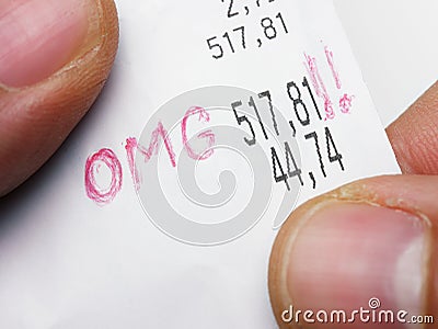 Closeup hands holding and check shopping bill Receipt Total Oh my God OMG surprised shocked Stock Photo