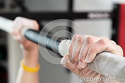 Closeup of hands holding a pull-ups bar Stock Photo