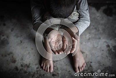 Closeup hands poor child begging you for help concept for poverty people, Human Rights Stock Photo