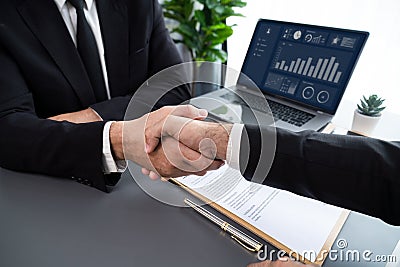 Closeup handshake in after successful business meeting. Fervent Stock Photo