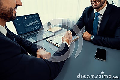 Closeup handshake in after successful business meeting. Fervent Stock Photo