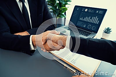 Closeup handshake in after successful business meeting. Fervent Stock Photo