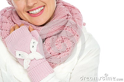 Closeup on happy woman in knit scarf and mittens Stock Photo