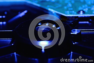 Closeup hard disk detail on blue background Stock Photo