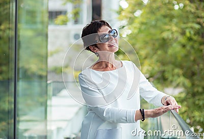 Mature woman looking upwards daydreaming Stock Photo