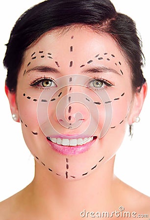 Closeup headshot caucasian woman with dotted lines drawn around face looking into camera, preparing cosmetic surgery Stock Photo