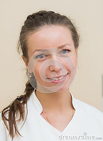 Closeup headshot portrait of friendly, smiling, confident female, woman doctor, looking at camera. Stock Photo