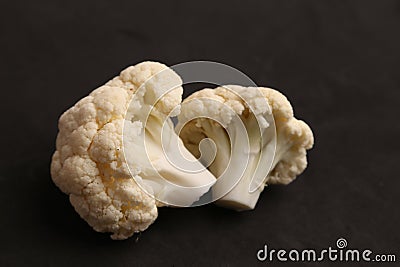 Closeup of a healthy Cauliflower on a black background Stock Photo