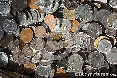 Closeup of a heap of coins with various sizes and colors Stock Photo