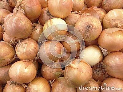 Closeup of a heap of yellow onions at the market Stock Photo