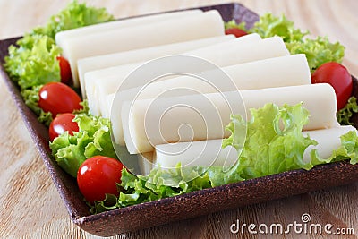 Closeup of Heart of palm (palmito) with cherry tomato Stock Photo