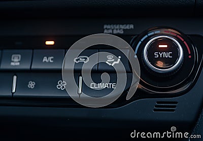 Closeup of a heat control panel of a modern car under the liht Stock Photo