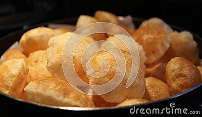 Closeup of homemade fried pani puri shells, an Indian snack food Stock Photo