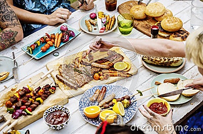 Closeup of homemade grilled food on wooden table summer party Stock Photo