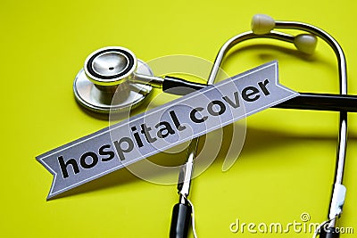 Closeup Hospital Cover with stethoscope concept inspiration on yellow background Stock Photo