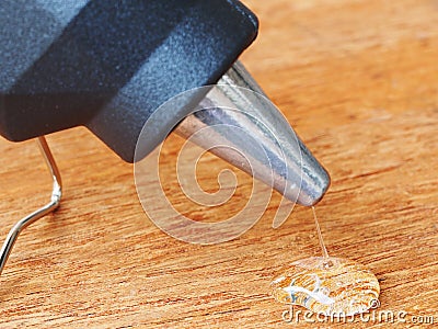 closeup hot glue gun with melted glue dripping out Stock Photo