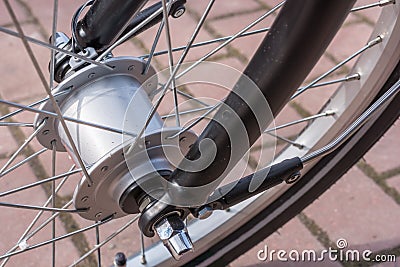 Hub dynamo in detail as a modern power generator on the bike Stock Photo